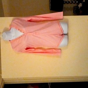 long sleeve pink bodysuit with buttons going down the front